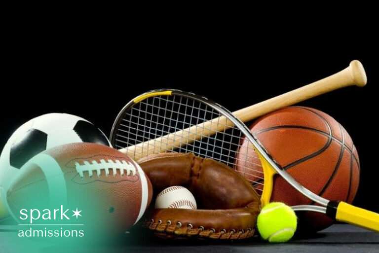 Collection of sports equipment including football, basketball, soccer ball, and tennis racket