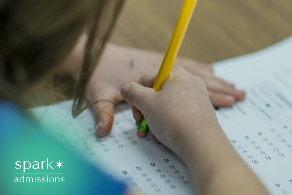 Student completing a multiple-choice exam using a pencil