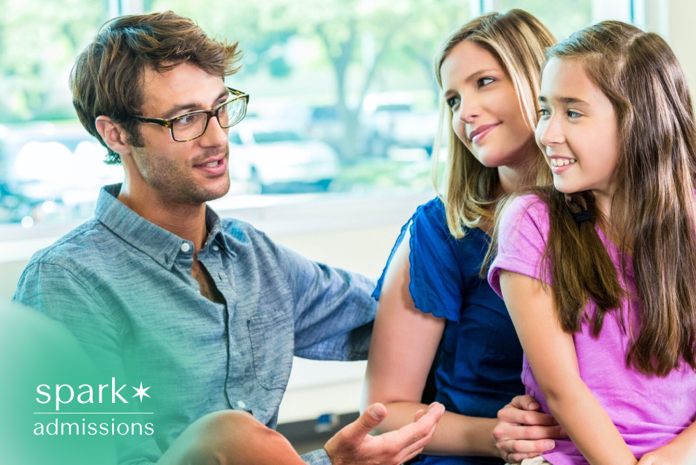 Parents and their daughter meeting with a school counselor to discuss academic planning and student support.