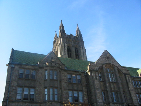 The large stone face of one of the massive buildings in Massachusetts.