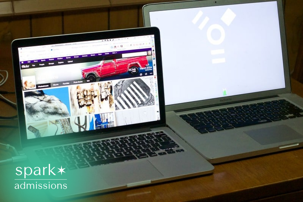 Two laptops on a desk displaying online content, representing college students using technology for research, online learning, and digital coursework.