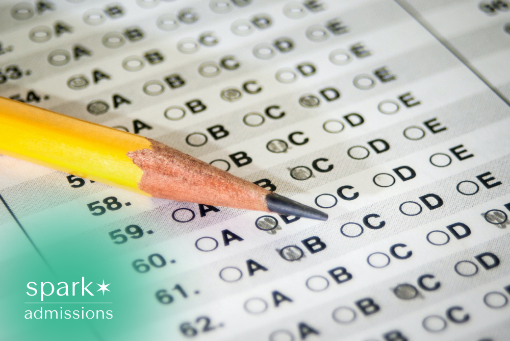 Sharpened pencil resting on a multiple-choice answer sheet during a standardized exam.