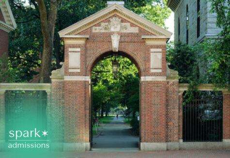 Harvard's gate to a prestigious university campus surrounded by trees