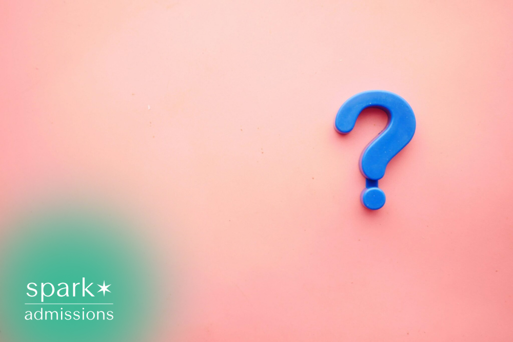 Blue question mark on a pink background with copy space.