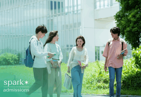 Group of college students smiling and discussing admissions