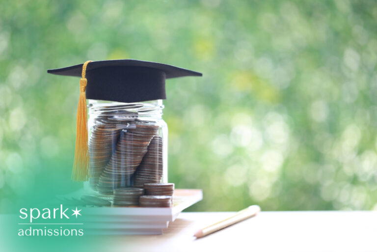 Graduation cap on a jar of savings with books symbolizing college education funding