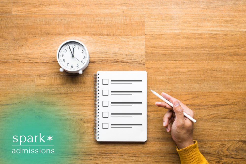 Notebook checklist, clock, and hand holding a pencil for study time management