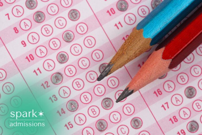 Close-up of a standardized multiple-choice test answer sheet with two sharpened pencils, representing college entrance exams and academic testing.