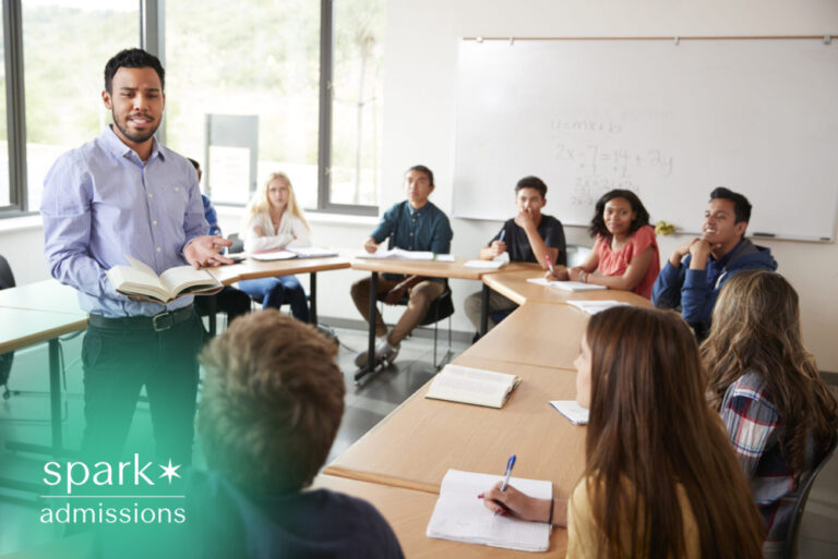 College professor leading a classroom discussion with university students engaged in an interactive lesson.