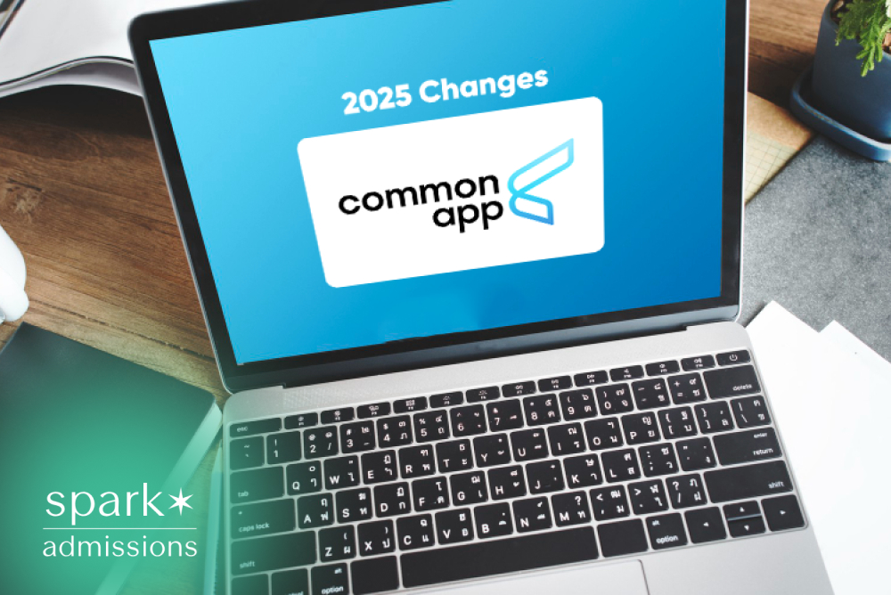 Laptop displaying the 2025 Common App updates on a desk with study materials, coffee, and office supplies.