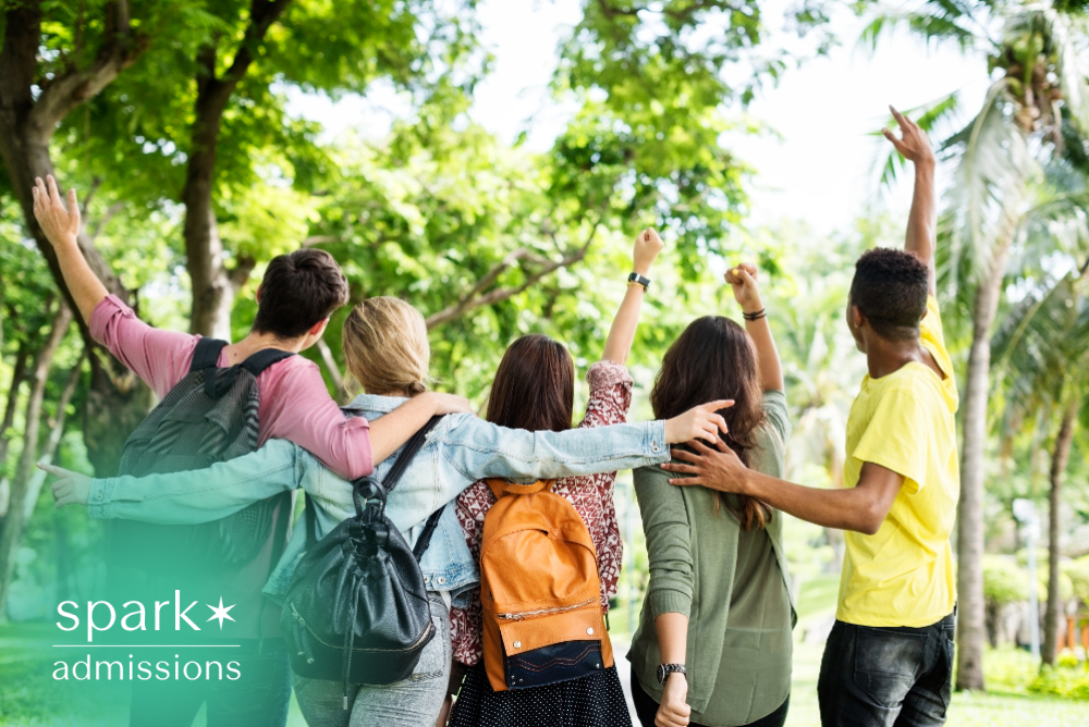 Diverse students walking together on campus with backpacks