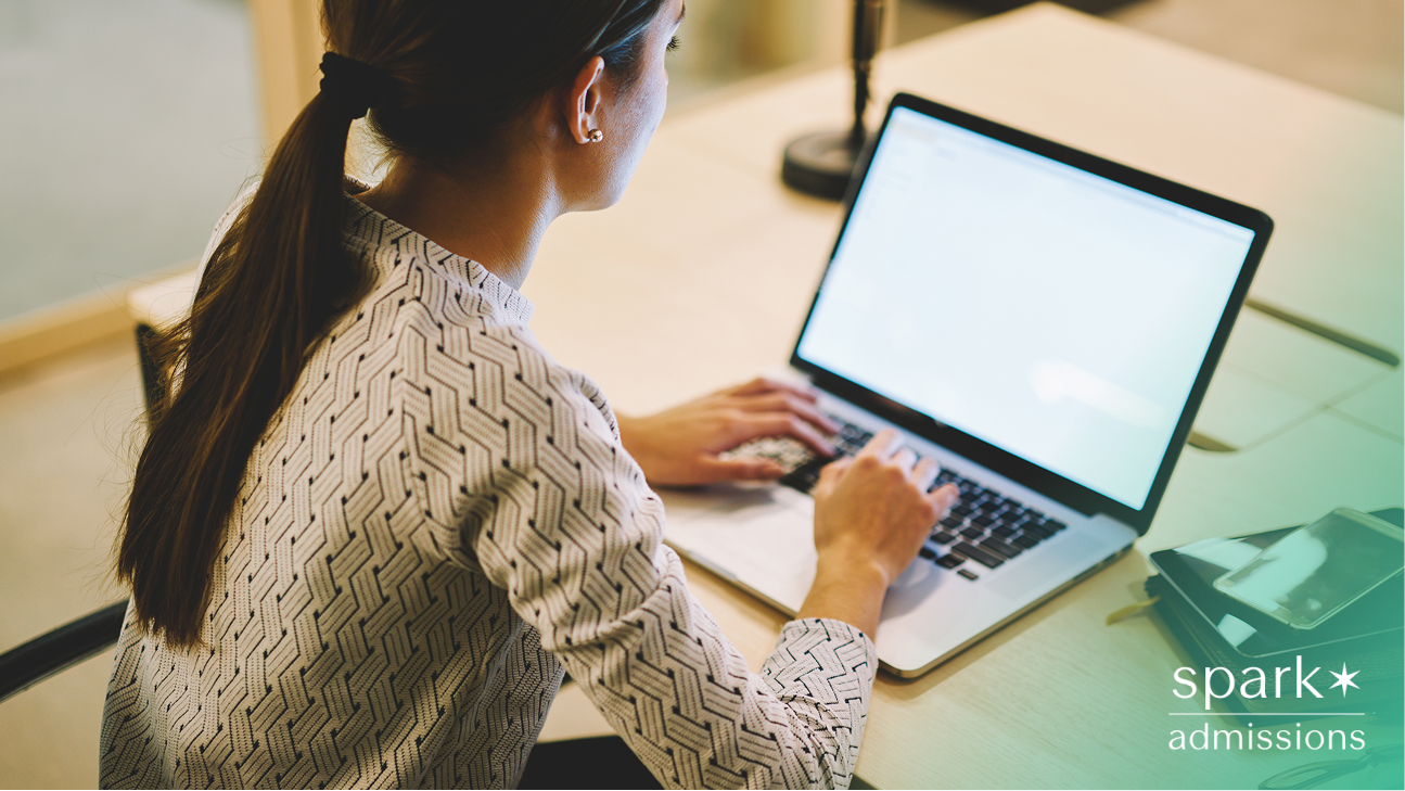 student using laptop to write essay