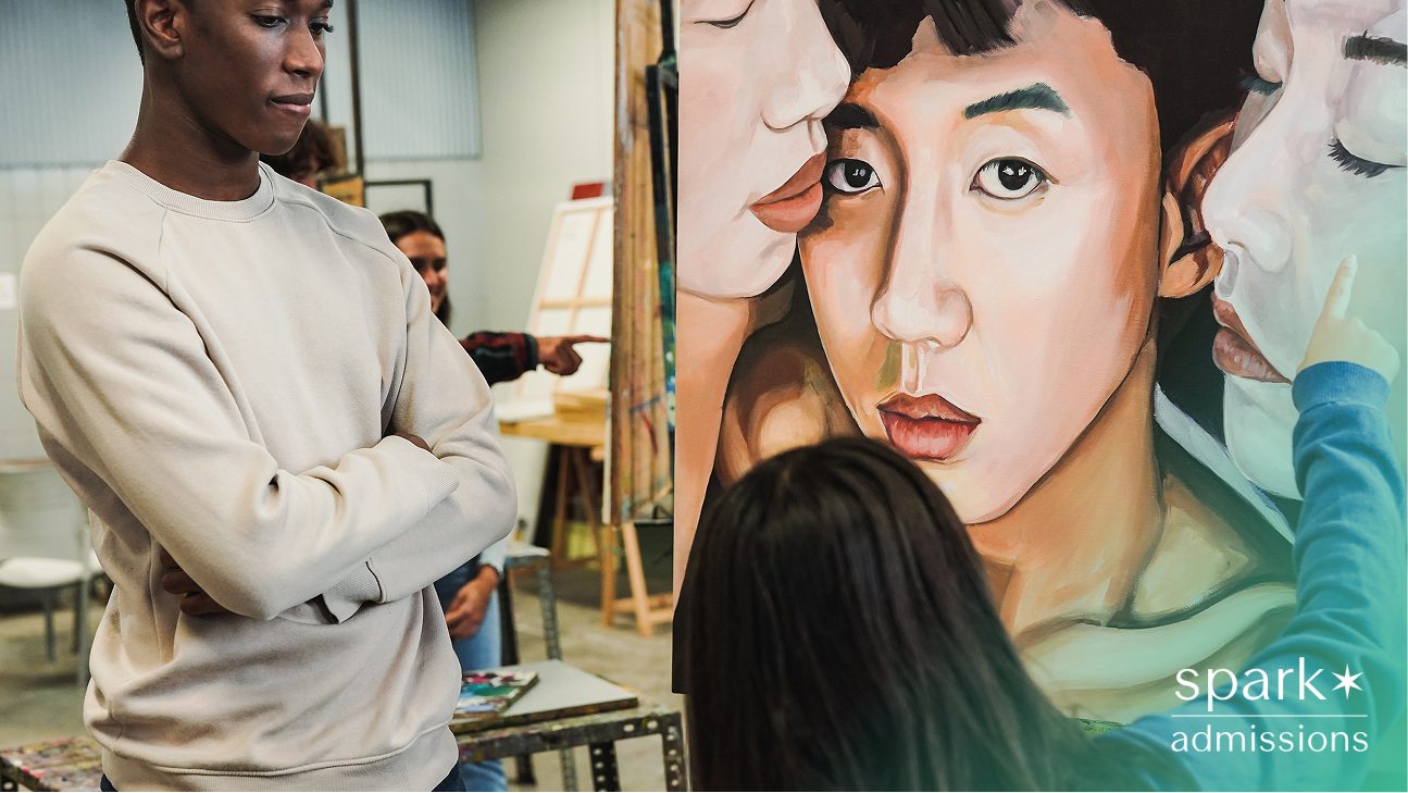 Young multiracial people analysing canva paint at university art class
