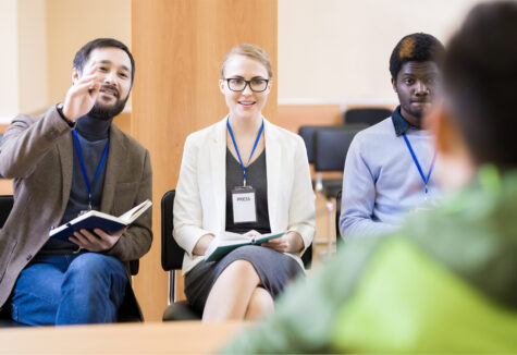 School official having a discussion with a student in an academic setting