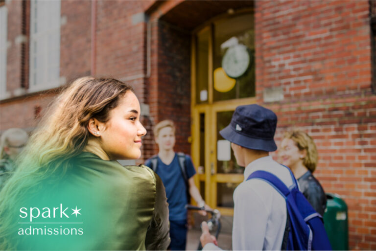 Students talking outside a brick campus building