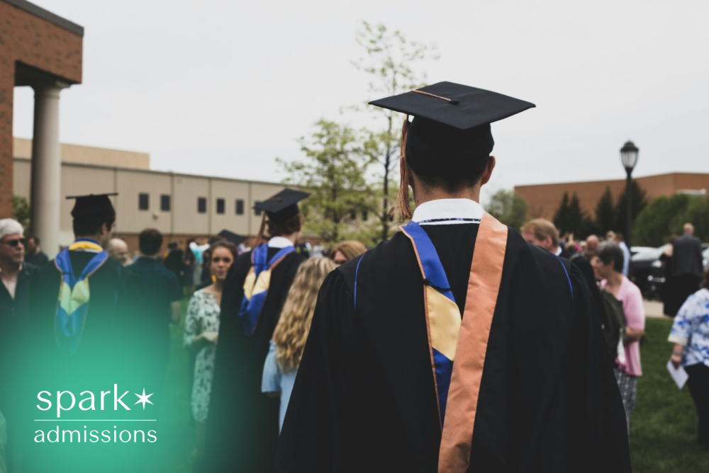 Graduates walking on campus during a commencement ceremony
