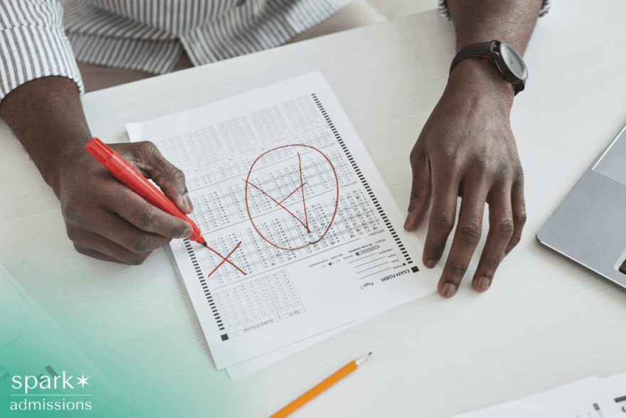 Professor holding test paper with A plus grade mark