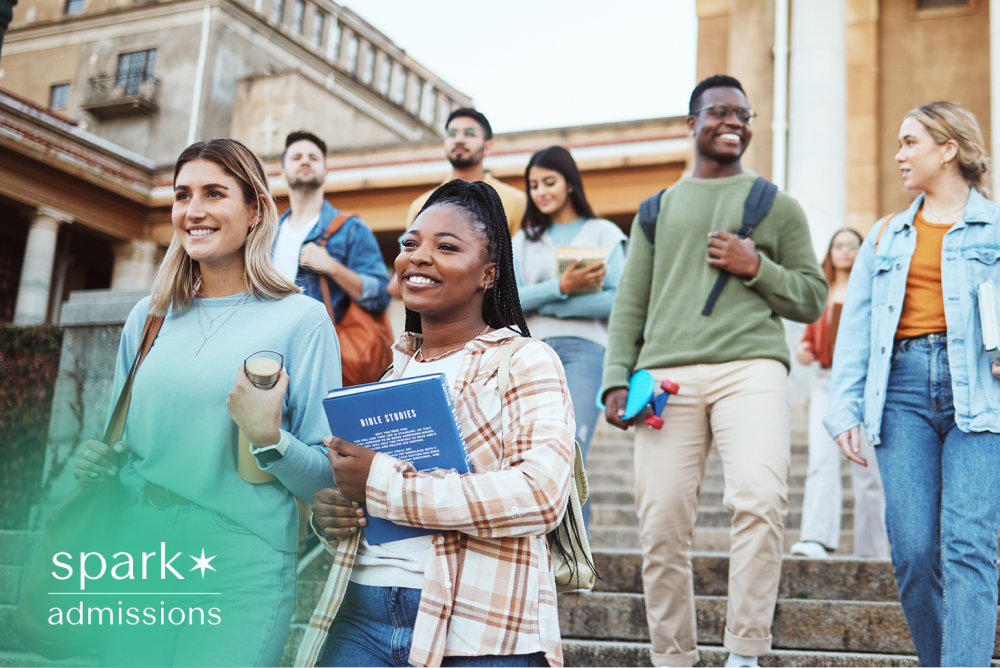 Diverse college students walking down campus steps with books