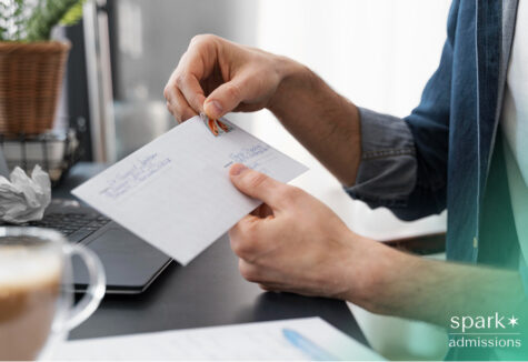 Close up man sealing envelope