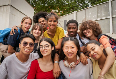 Selfie of a group of students looking at the camera smiling.