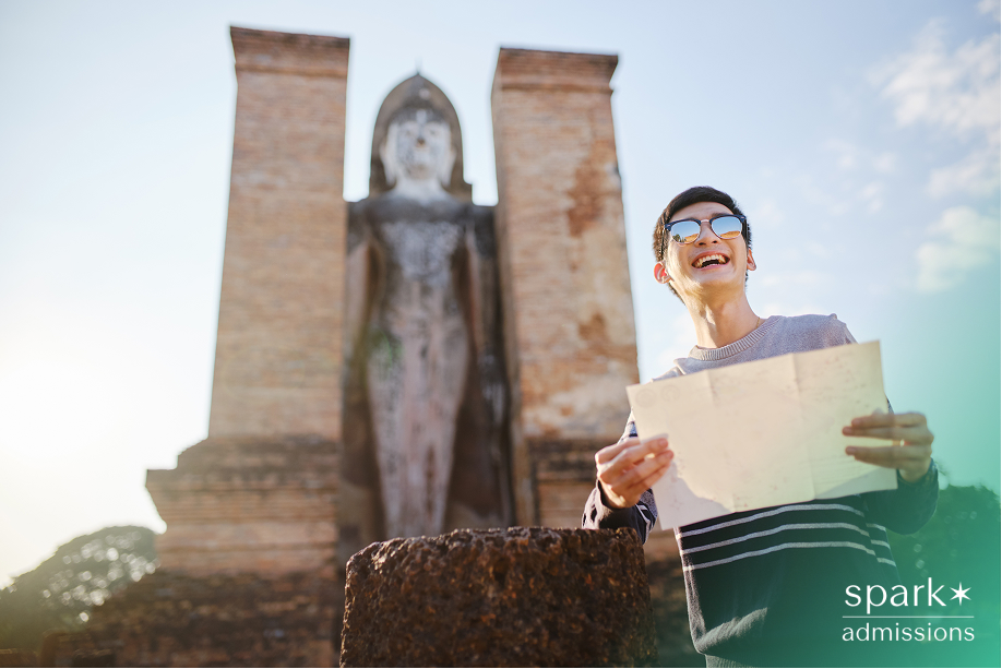 Student traveler exploring a historic site, representing how voluntourism can prioritize personal experience over real community impact.