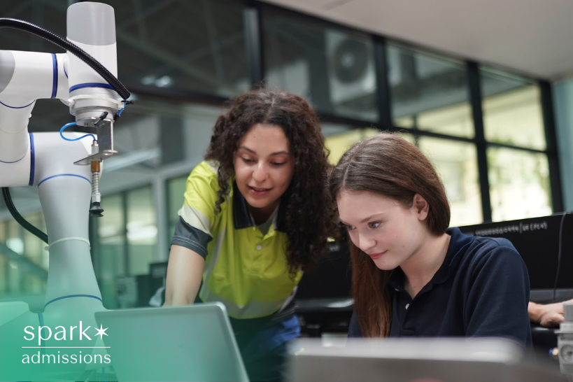 Female mentor guiding a young student exploring computer science interests