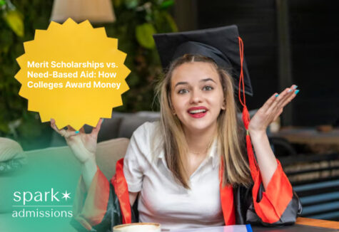 Graduate holding a sign about merit scholarships and need-based financial aid