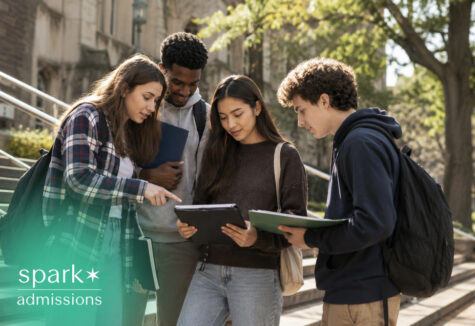 students reviewing application materials together on campus