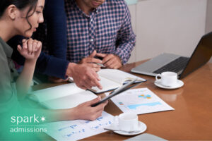 Business team reviewing performance data, reports, and charts during a meeting.