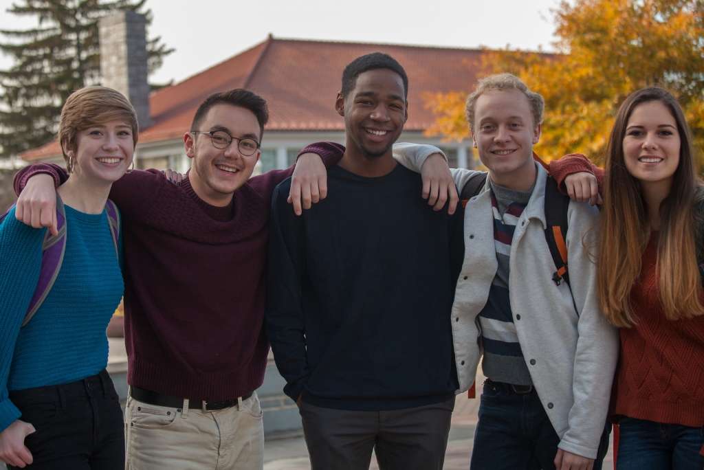 Group of college friends on campus, representing students supported by a college admissions consultant.