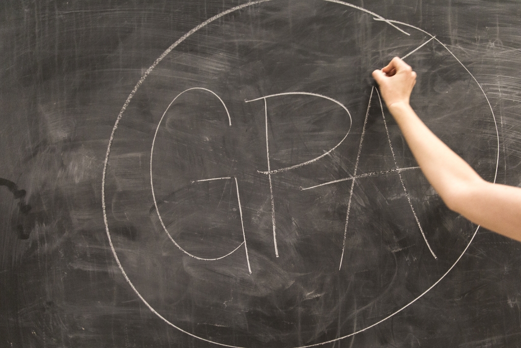 GPA written on a classroom chalkboard representing grades and academic performance for college admissions.