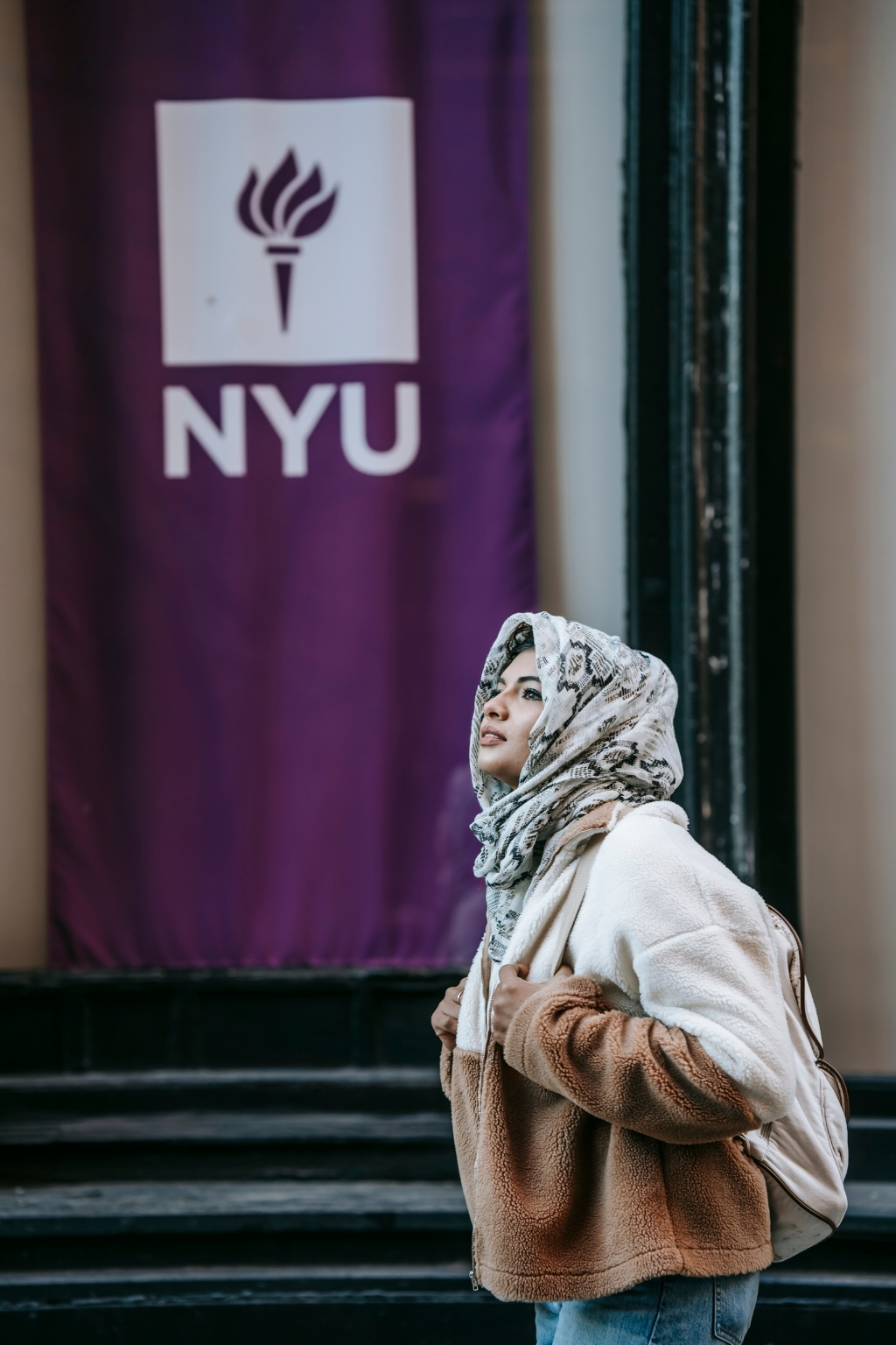 NYU student on campus representing New York University admissions and college life.