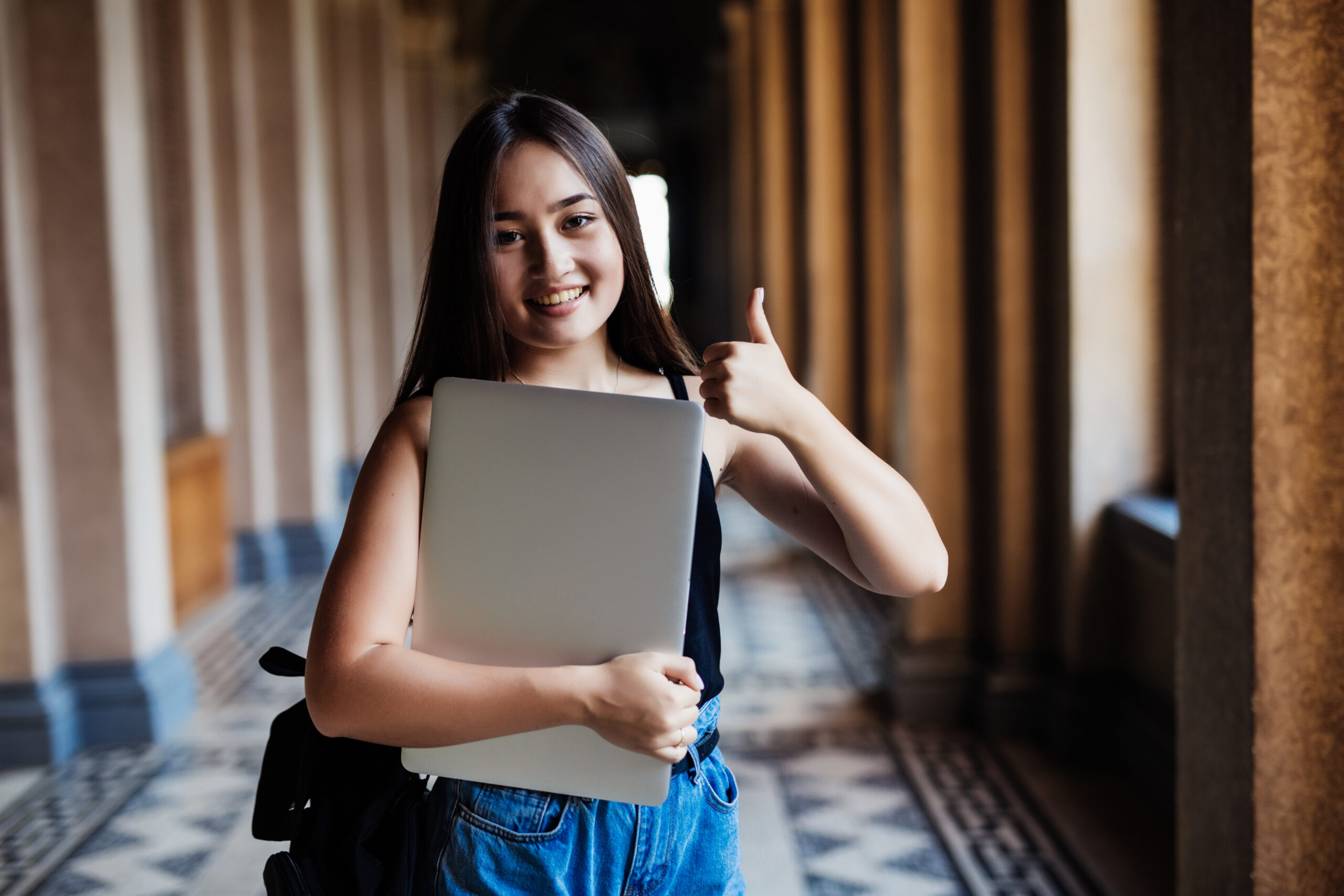 High school student with laptop representing pre-law admissions consulting and college application planning.