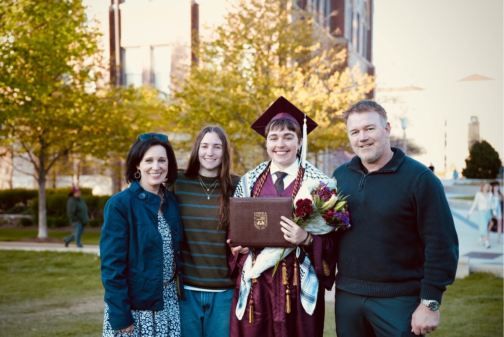 College graduate celebrating with family, representing pre-law admissions planning for high school students.